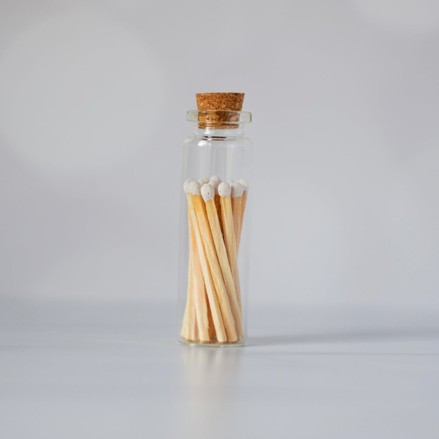 white matchsticks in apothecary bottle