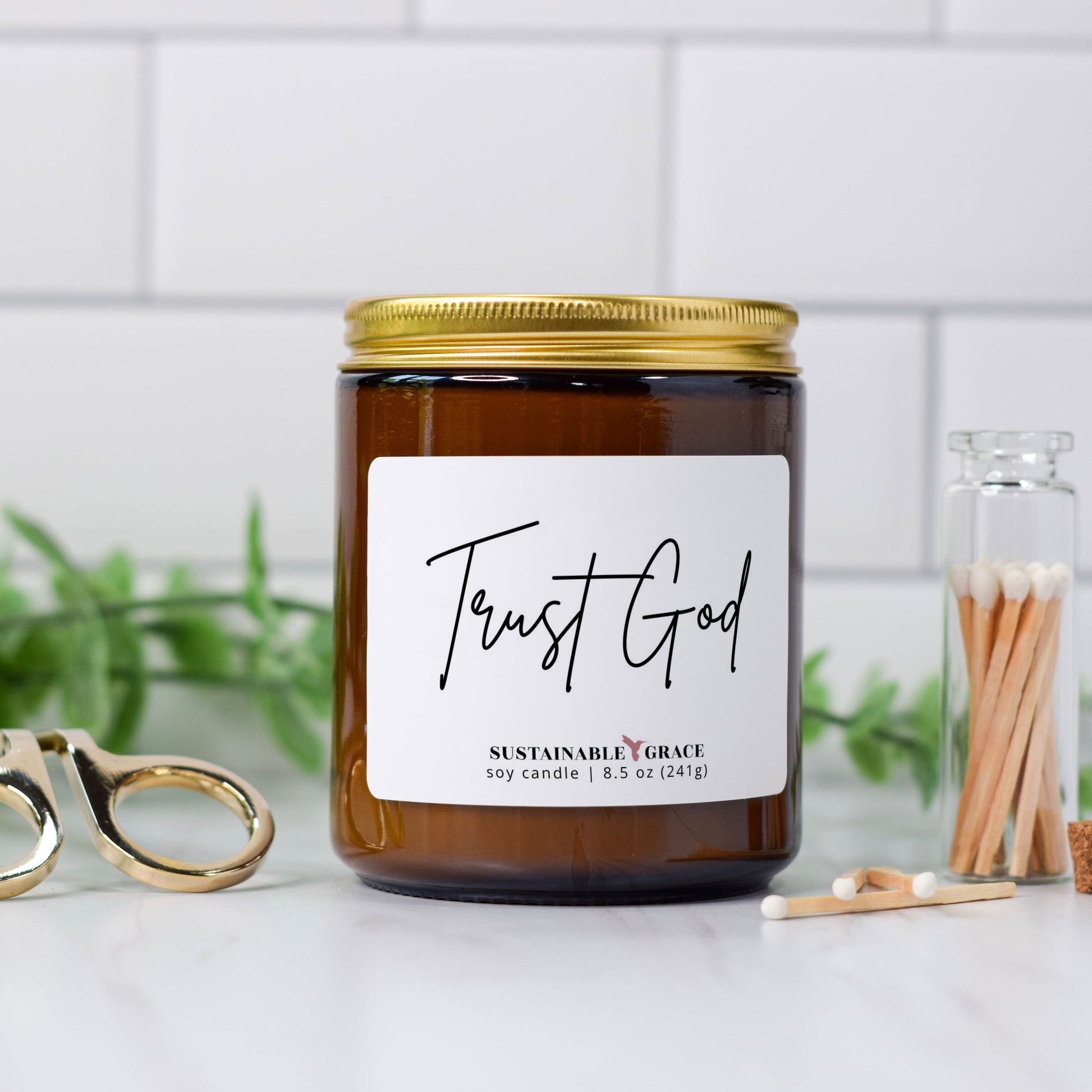 trust God soy candle in amber jar with gold lid