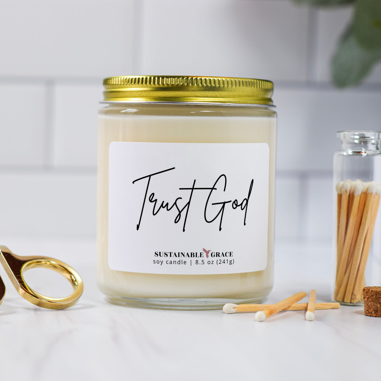 trust god candle with gold lid
