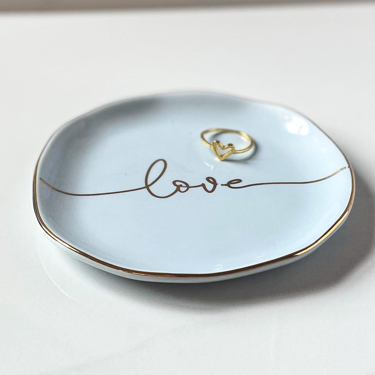 open heart ring on love jewelry dish