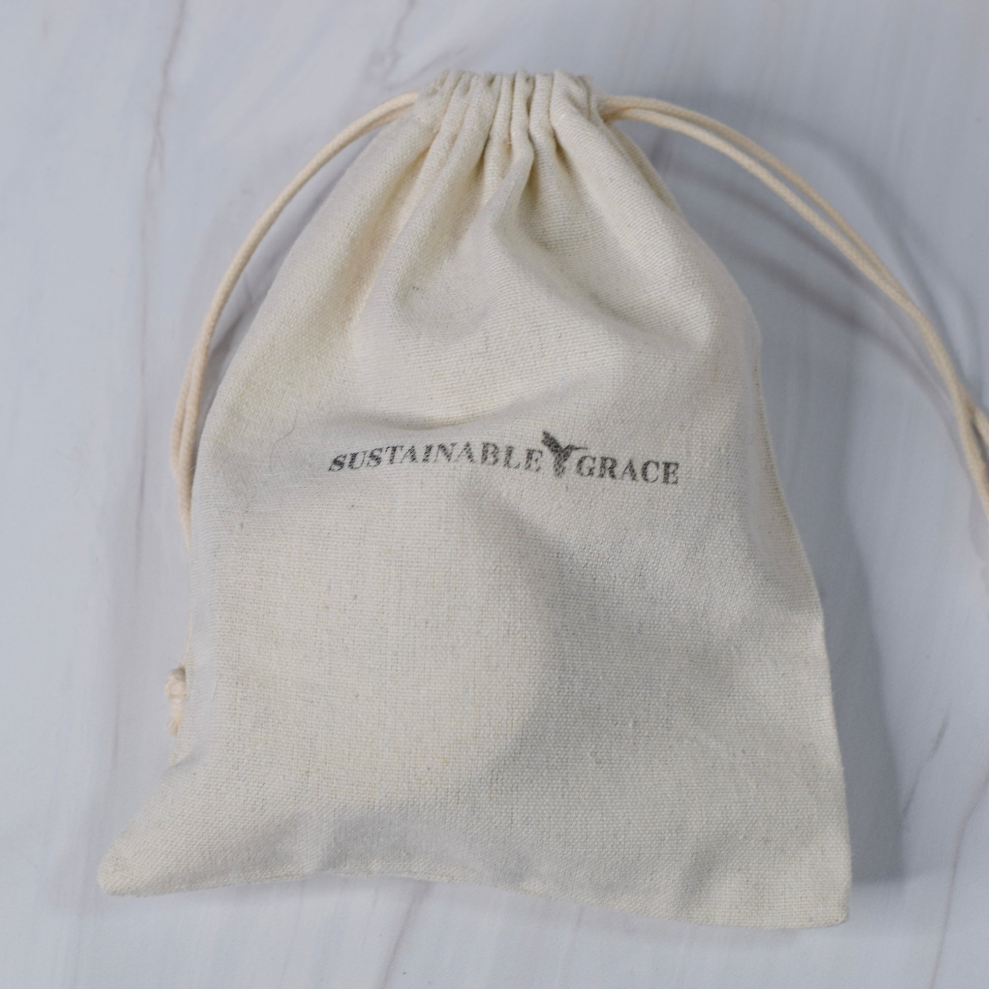 muslin gift bag for candles from sustainable grace