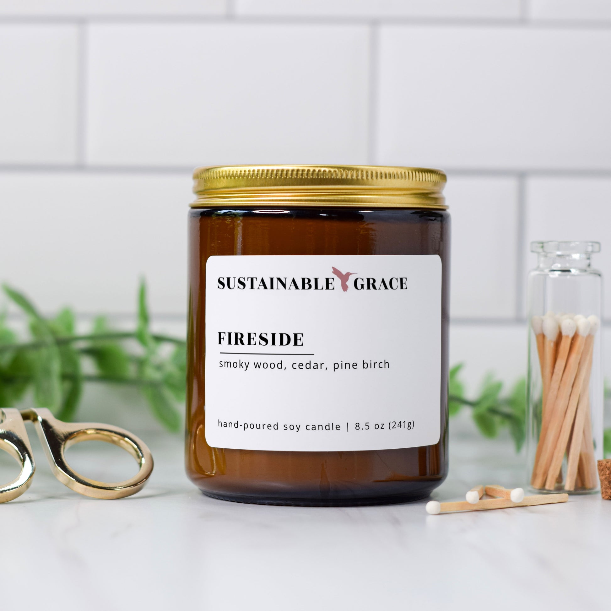 fireside soy candle in amber glass jar with gold lid from sustainable grace 