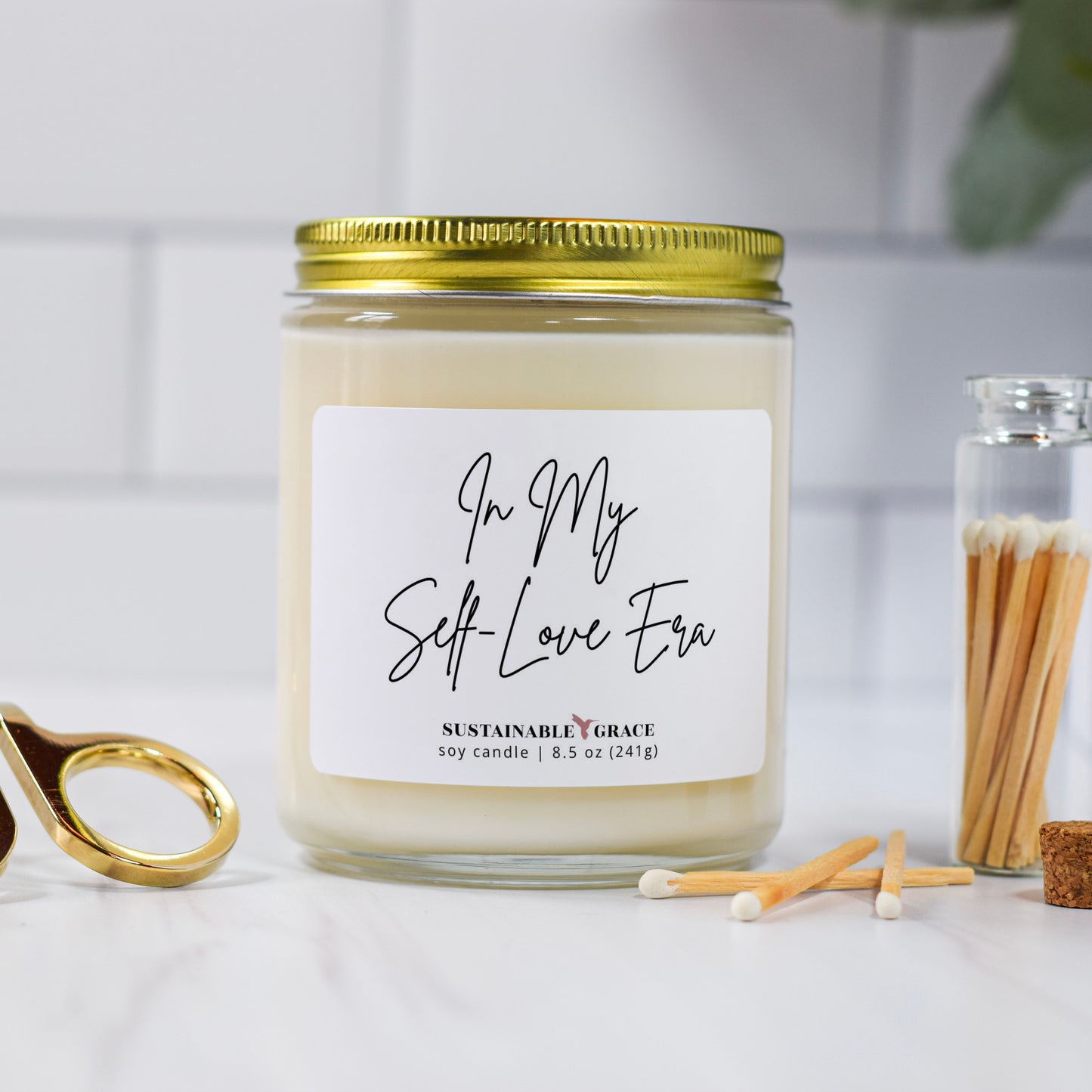 in my self love era candle with gold lid 