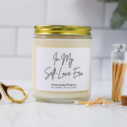 in my self love era candle with gold lid 
