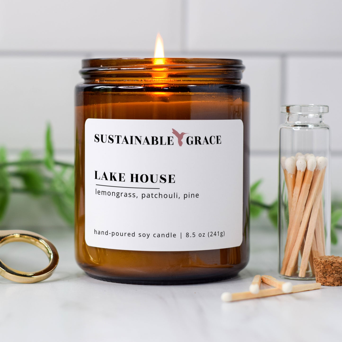 lake house lemongrass and patchouli scented soy wax candle in amber glass jar