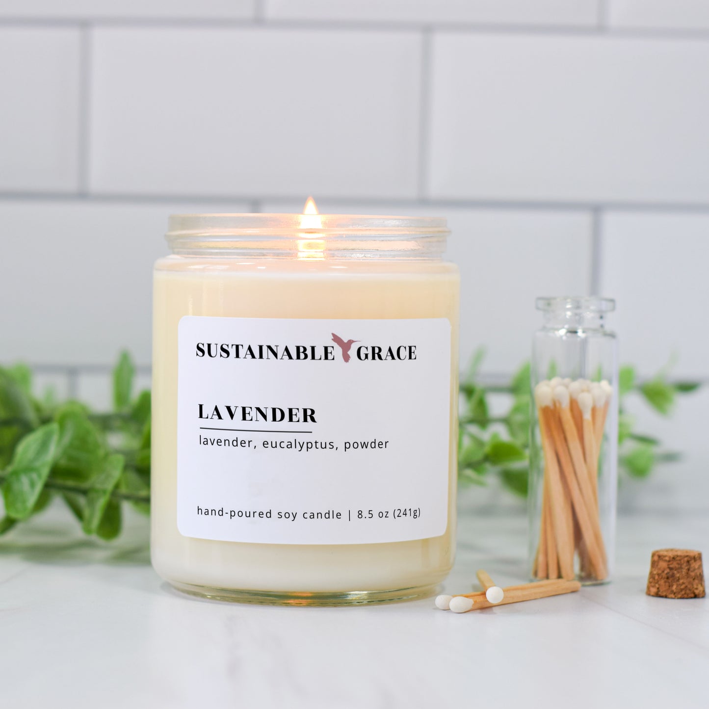 lit lavender soy candle from sustainable grace