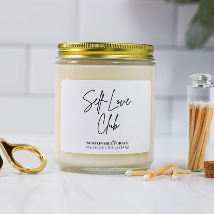 self love club candle with gold lid 