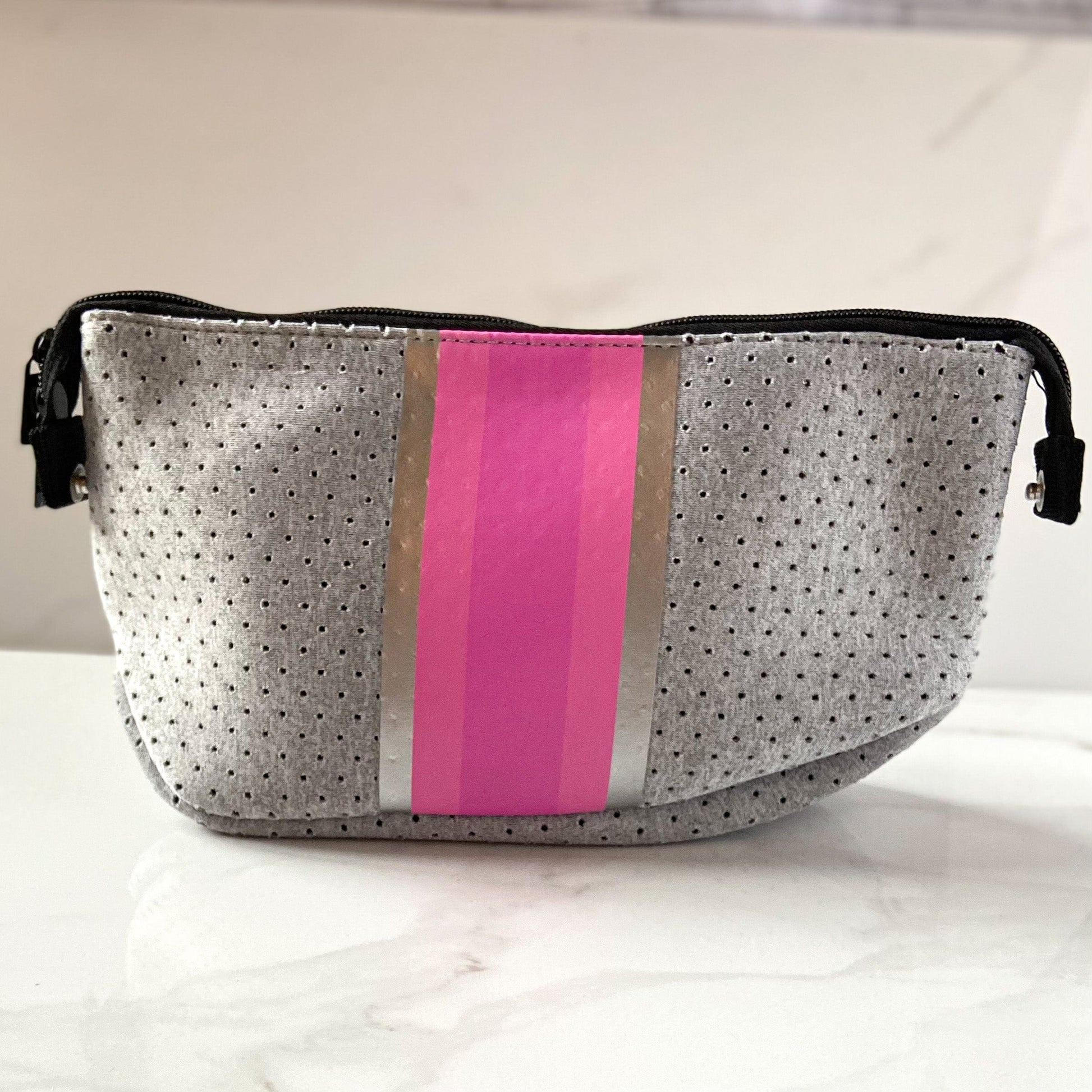 Neoprene makeup bag in gray with pink stripe and zipper top closure