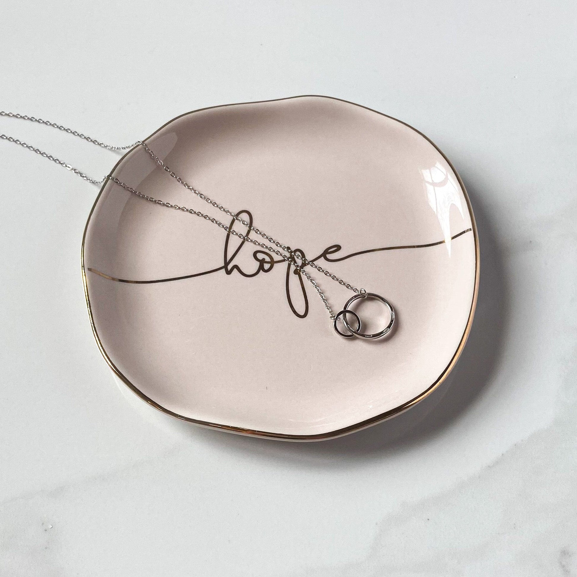 double circle necklace in silver on hope jewelry dish