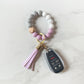 purple bracelet keychain with car keys