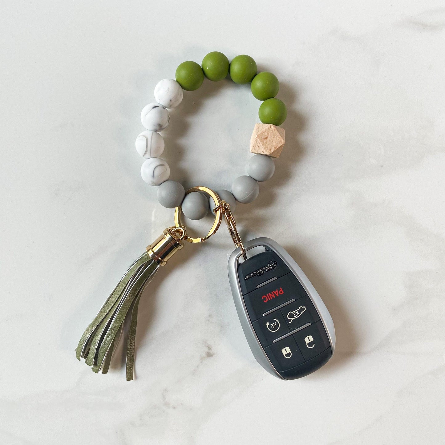 army green bracelet keychain with car keys