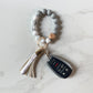 white bracelet keychain with car keys