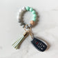 teal bracelet keychain with car keys